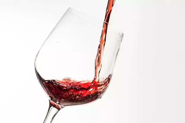 red-wine-pouring-into-wine-glass_53876-105948